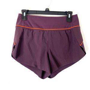 Athleta Run With It Dark Purple Neon Orange Lined Running Shorts Mesh Split Side